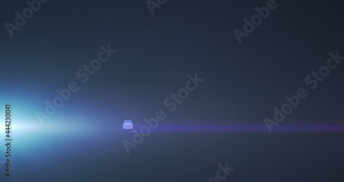 Glowing blue spot of light flickering against black background