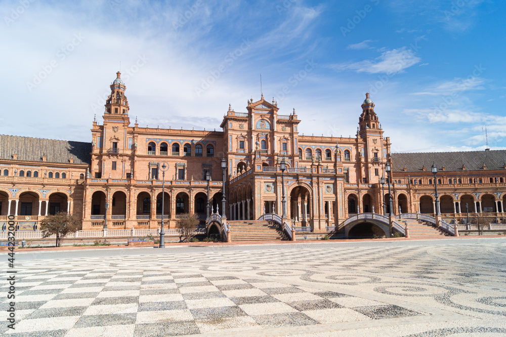 Front view of the main building in the Plaza de Espana in Seville (Andalusia, Spain). Architectural complex and emblematic place of the city. Monumental and historical building in Andalusia.