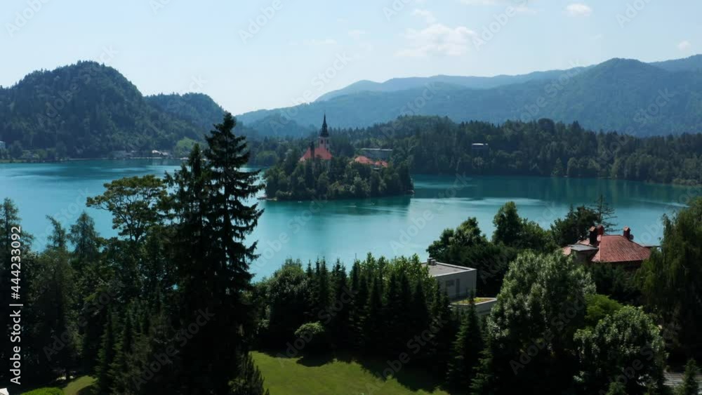 Blue Water Of Bled Lake Overlooking The Zaka Valley In Bled Island, Slovenia. aerial Blue Water Of Bled Lake Overlooking The Zaka Valley In Bled Island, Slovenia. aerial