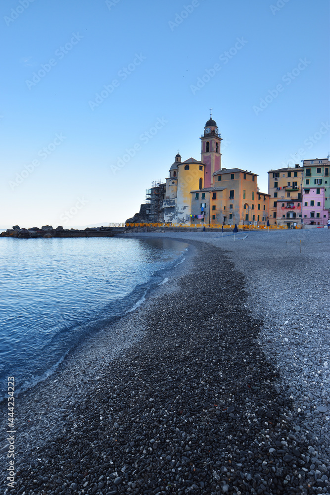 characteristic pebble beach in Camogli, with sea view and glimpse of the city
