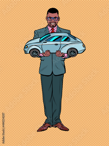 Passenger car in the hands of the seller. A black male businessman. Rental and sale of motor vehicles