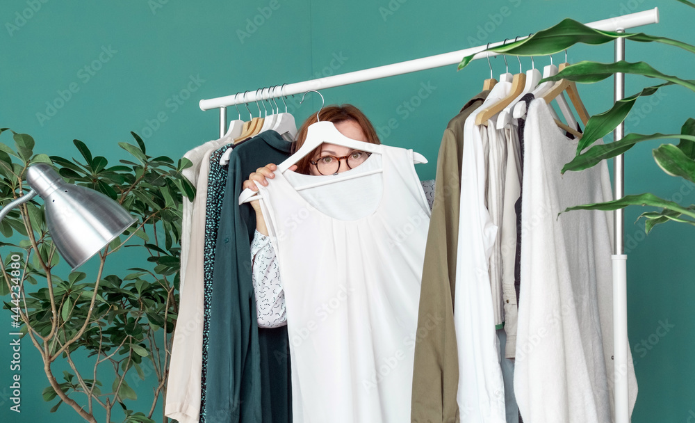 middle aged woman shopping new dress clothes shelf green middle aged woman shopping new dress clothes shelf green