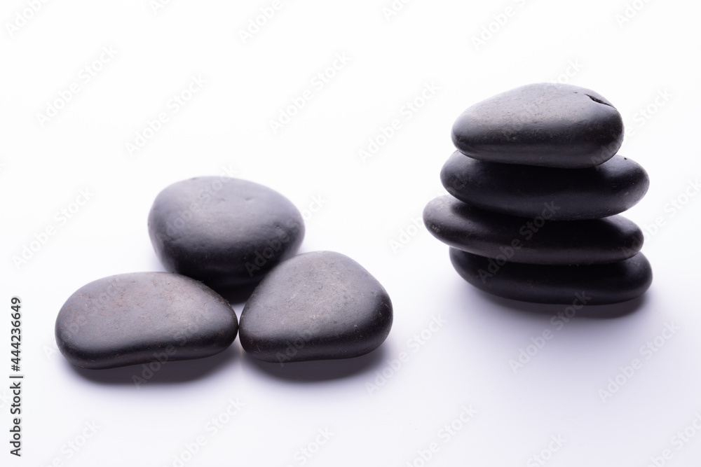 Balanced pile of spa stones isolated on white background Balanced pile of spa stones isolated on white background