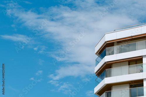 Corner of minimal beach house with glass balconies and simple lines in San Sebastian, Basque country, Spain