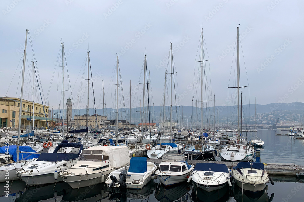 Sailing Boats docked in an old port in Trieste, Italy,