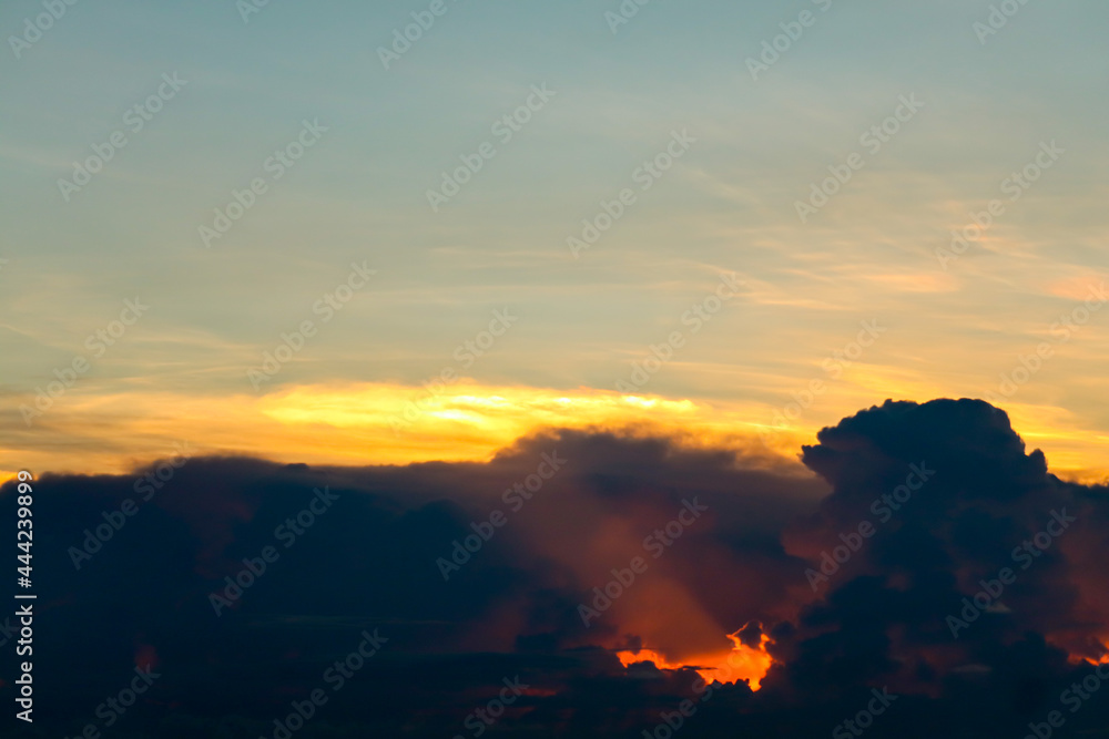 sunset sky back on dark silhouette cloud red lava hole of sun ray last light