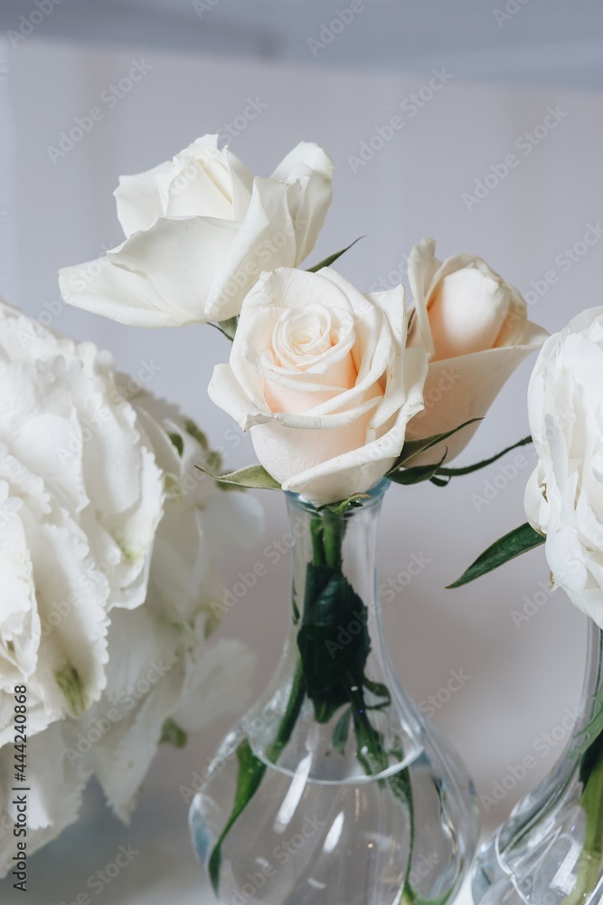 Romantic Wedding Table Top Layout Decor with large lush floral bouquets including white roses, ranunculus, persian buttercups, white orchids and candles