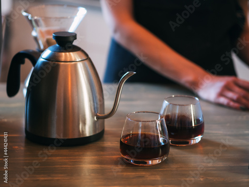Two glasses of espresso coffee prepared by an alternative method in kemex photo