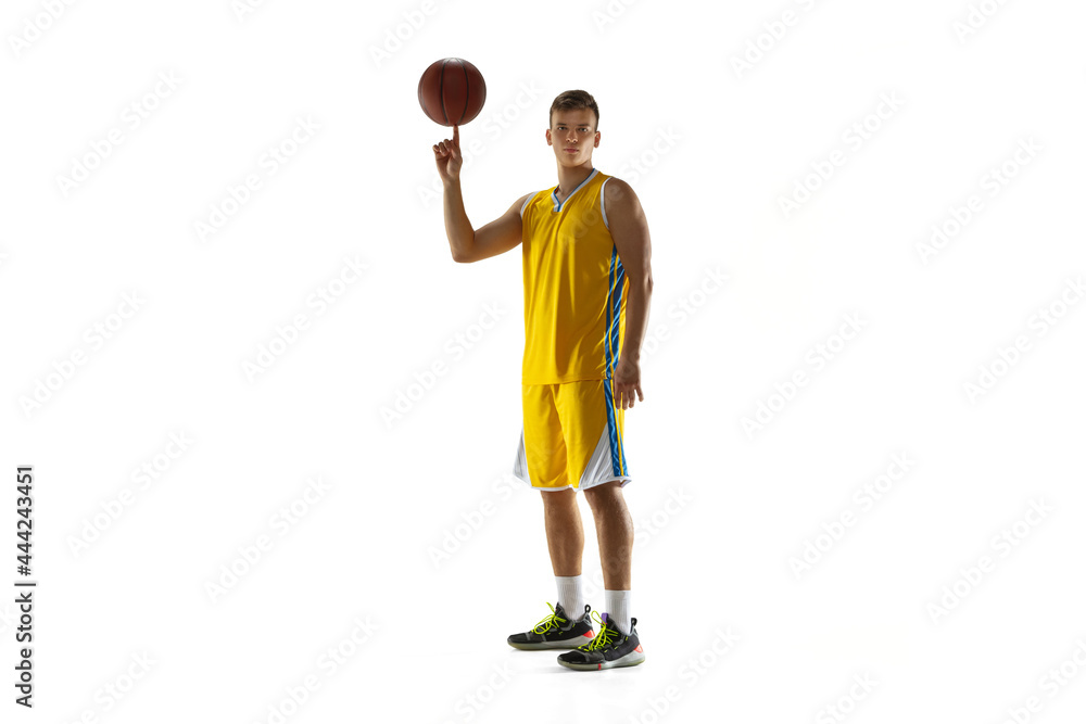 Portrait of young man, basketball player posing isolated on white studio background. Motion, activity, movement, sport game concepts.