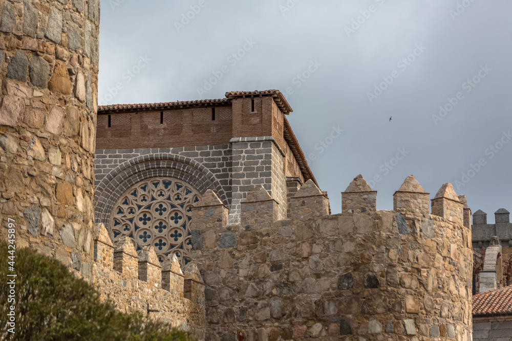 Detailed view of Avila city Walls and fortress tower, blue sky as background