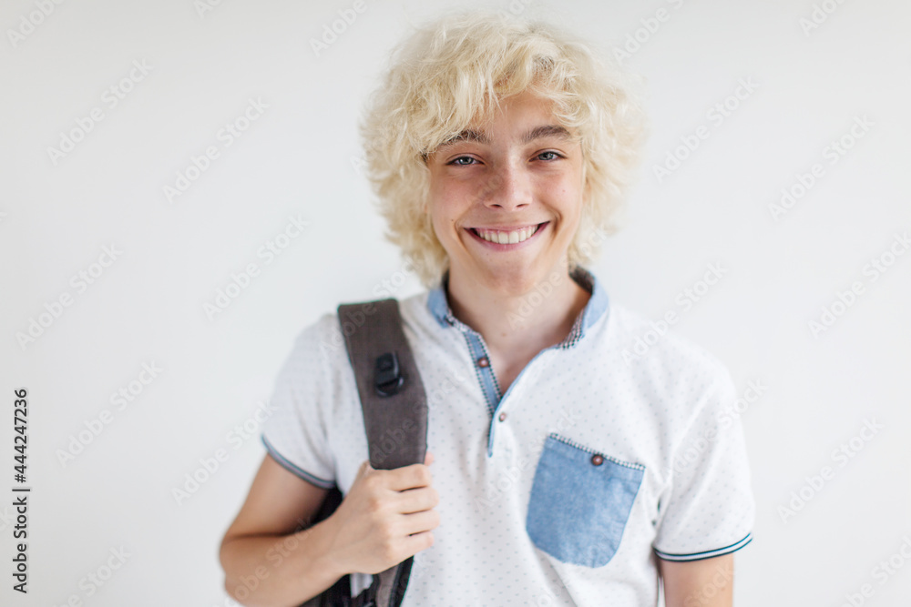 Portrait of cheerful young blond man smiling looking at camera Portrait of cheerful young blond man smiling looking at camera