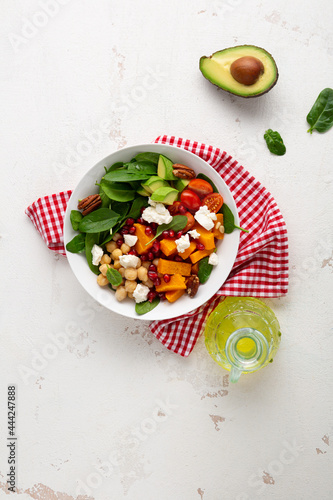 Overhead view of  winter pumpkin salad with avocado healthy food