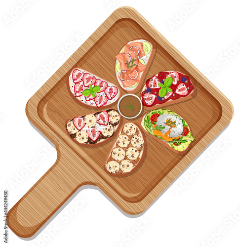 Top view of different bruschetta on a round plate isolated