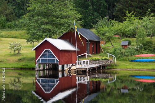 Haverud, Sweden A house is reflected in the water along the  Dalsland Canal in western central Sweden on a bridge. photo