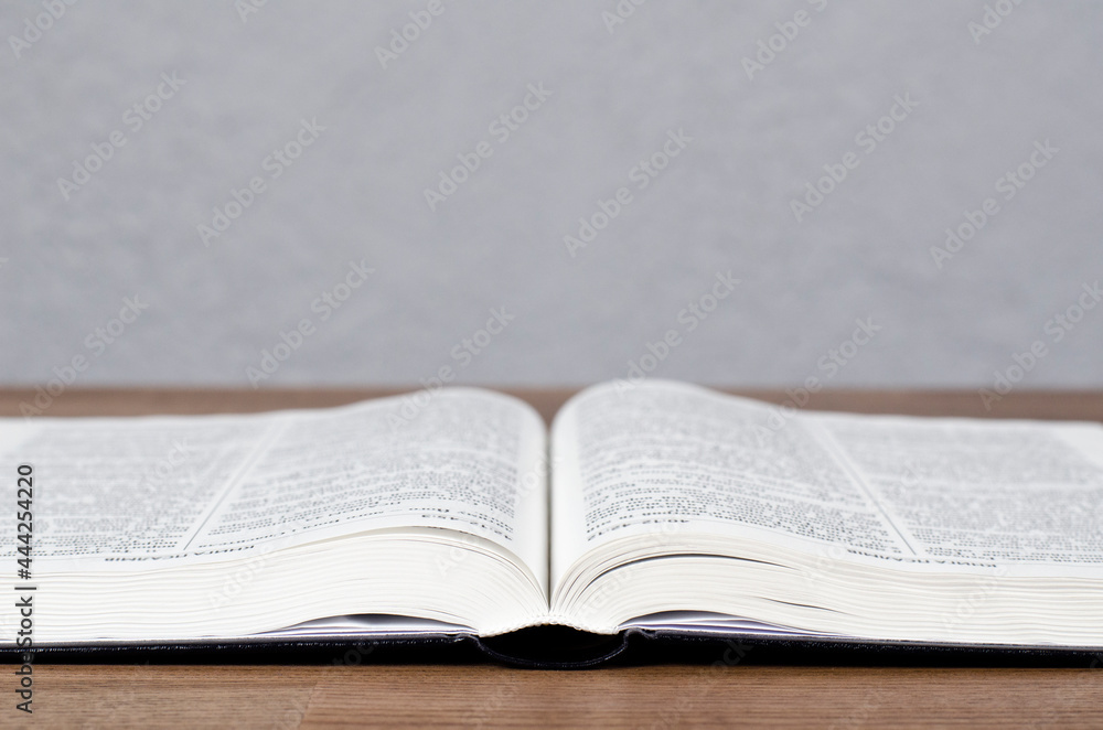 Fototapeta premium The open book is the holy bible. On the table