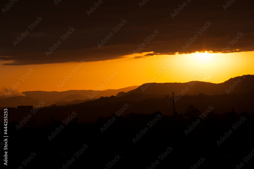 sunset over the city and mountains sunset over the city and mountains