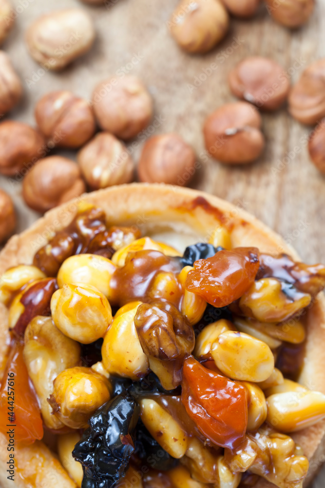 dough tartlet nuts and dried fruits covered with caramel dough tartlet nuts and dried fruits covered with caramel