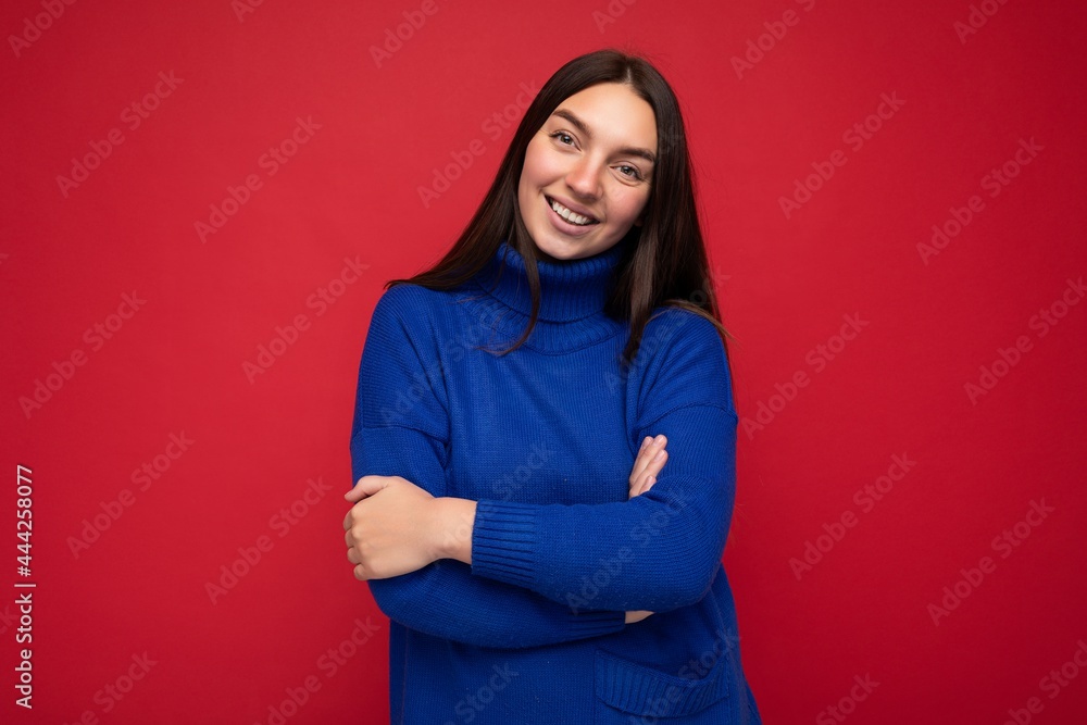 Photo shot of pretty joyful smiling young female person wearing casual trendy outfit standing isolated on colourful background with copy space looking at camera and having fun Photo shot of pretty joyful smiling young female person wearing casual trendy outfit standing isolated on colourful background with copy space looking at camera and having fun