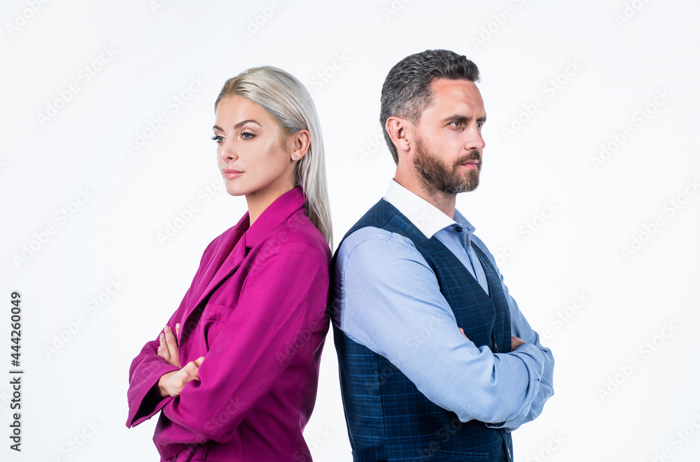 business couple. blonde woman in pink jacket and man crossed hands. back to back. business couple. blonde woman in pink jacket and man crossed hands. back to back.