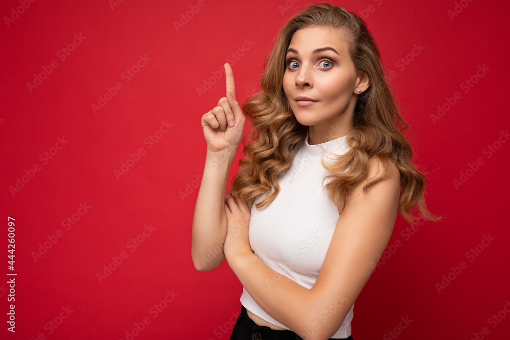 Photo of cute nice winsome positive adult woman wearing casual outfit isolated on background wall with copy space pointing at free space with hands Photo of cute nice winsome positive adult woman wearing casual outfit isolated on background wall with copy space pointing at free space with hands