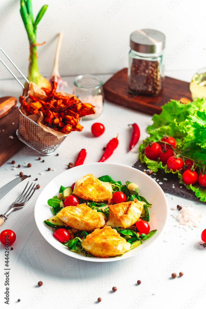 Camembert. Fried camembert cheese with batat fries. Cheese with salad with tomatoes. Fresh food Camembert. Fried camembert cheese with batat fries. Cheese with salad with tomatoes. Fresh food