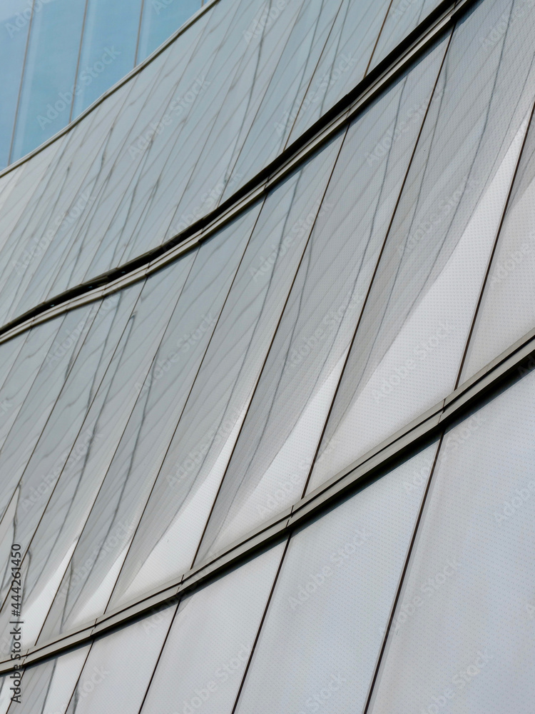 Obraz premium Grey lined surface of urban buildings in San Sebastian, Basque country, Spain. Modern lines for backdrops and backgrounds