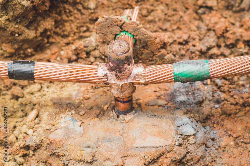 Welding copper ground wire on ground rod.Welding copper ground wire
