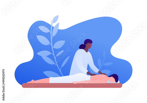 Massage therapy concept. Vector flat people illustration. African american woman therapist massaging and patient person lying on couch. Design for health care, wellness.