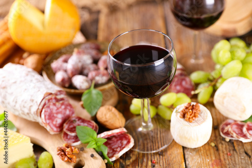red wine glasses with cheese and salami