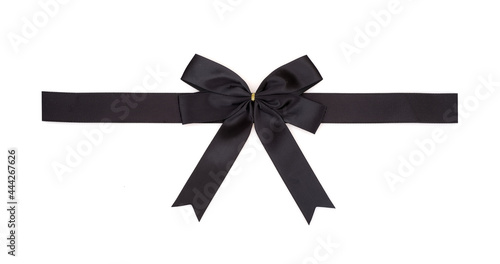 Decorative black silk bow and ribbon isolated on white background