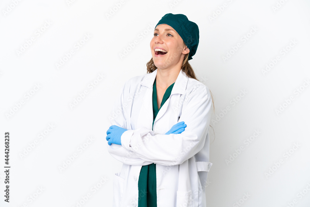 Surgeon caucasian woman in green uniform isolated on white background happy and smiling Surgeon caucasian woman in green uniform isolated on white background happy and smiling