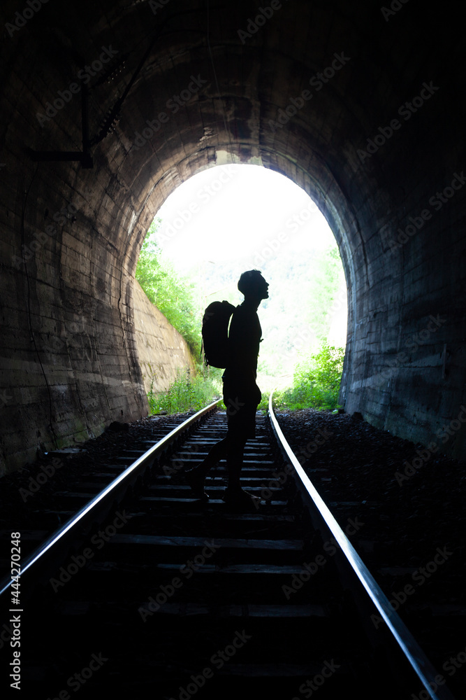 Man figure on lingh - End of Tunnel concept stock photo