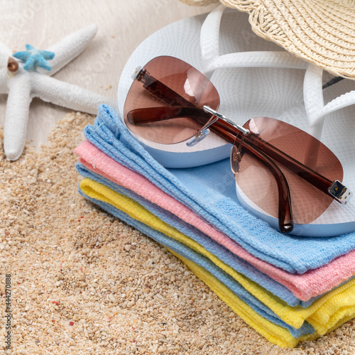 Summer beach background design concept with accessories on white table background.
