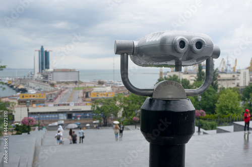 Tourist city binoculars on an resort town sea view