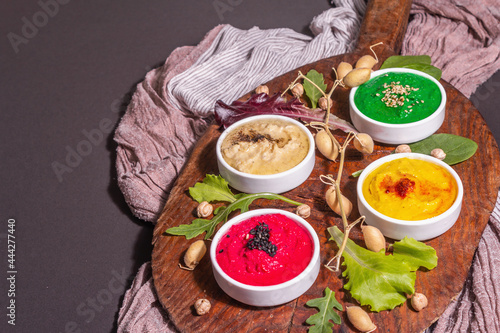 Colorful hummus bowls, healthy vegan dips