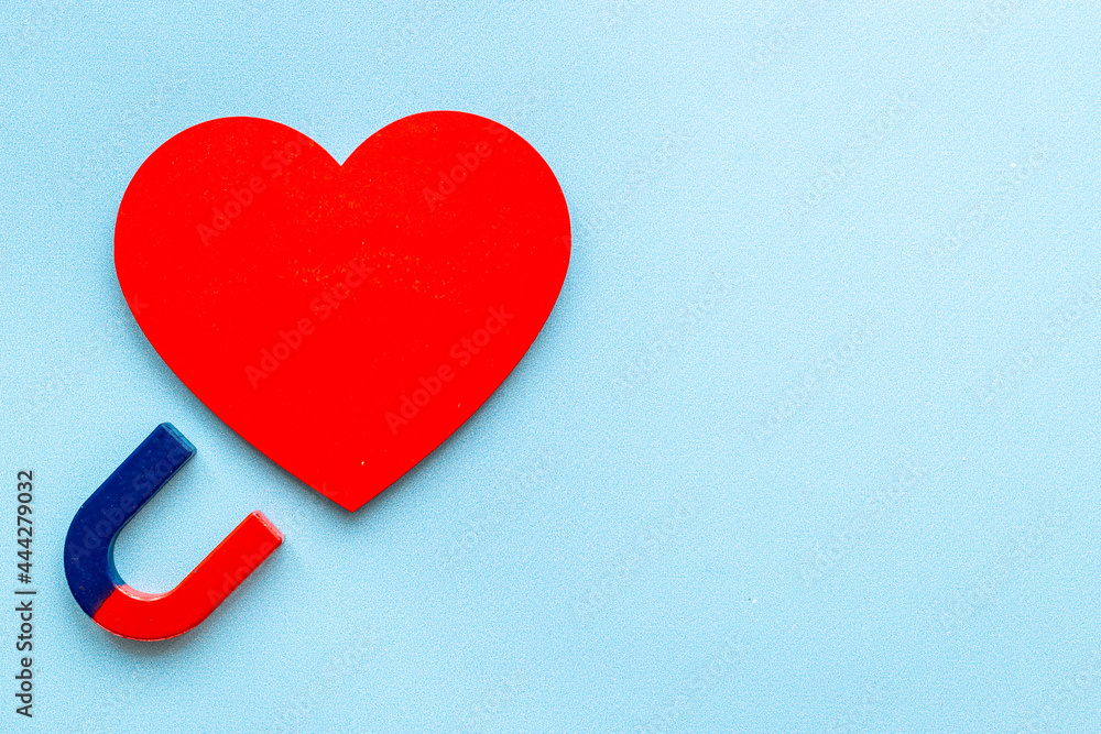 Fototapeta premium Dating love concept. Magnet with heart shapes, top view