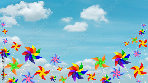 Colorful blades turbines on white cloud, paper rainbow windmill illustration © Arunee
