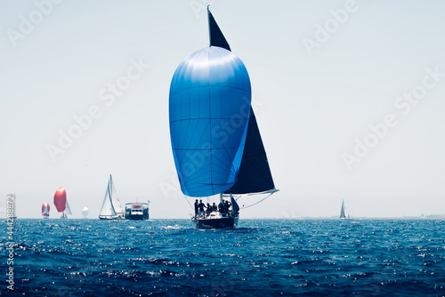 Sailboats during the regatta, front boat with blue sail