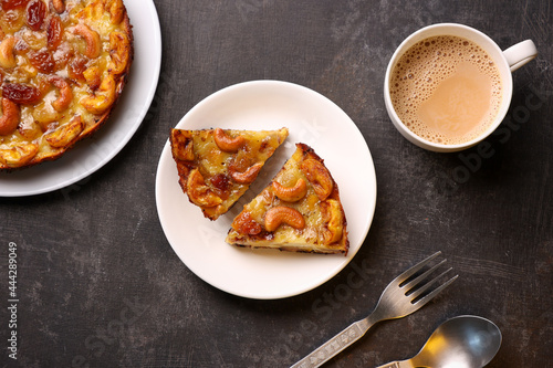 Malabar banana cake kayappola, Indian milk tea  pazham pola , banana pie made in skillet fruitcake made with eggs and Kerala banana for Ramadan, Eid . tea time snack breakfast dessert India Sri Lanka  photo