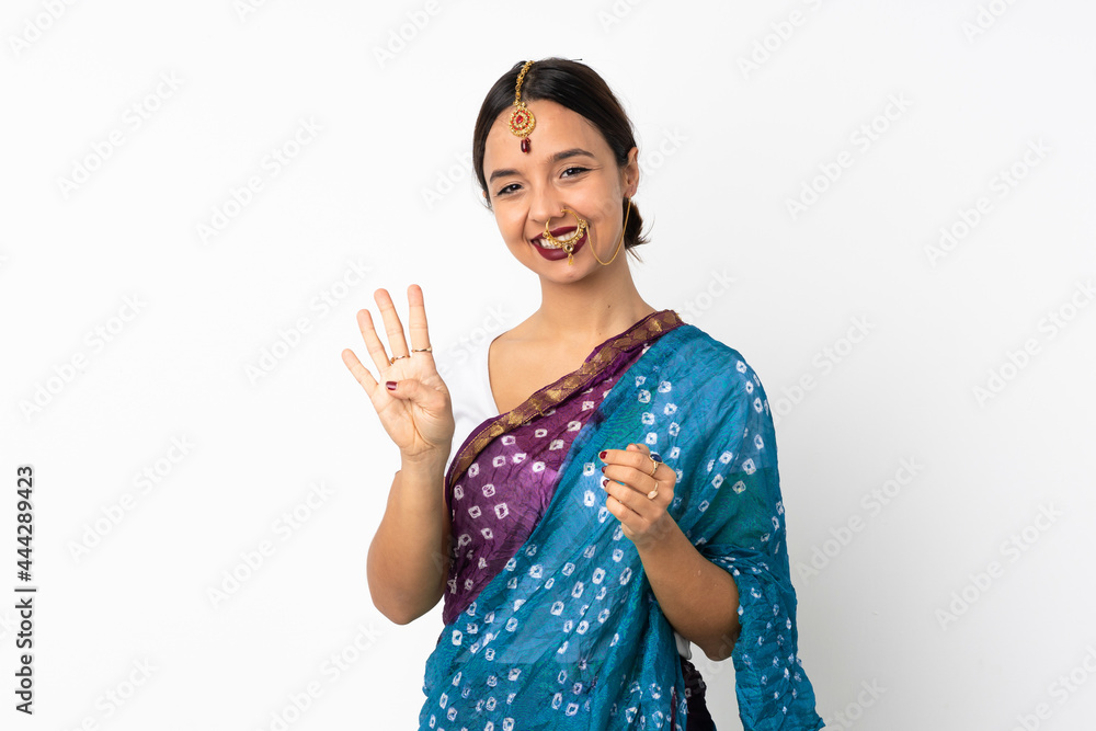Young indian woman isolated on white background happy and counting four with fingers Young indian woman isolated on white background happy and counting four with fingers