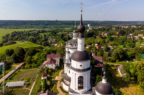 Bell tower and cathedral of the Orthodox Chernoostrovsky monastery in Maloyaroslavets, Russia, beautiful aerial view. June 2021 photo