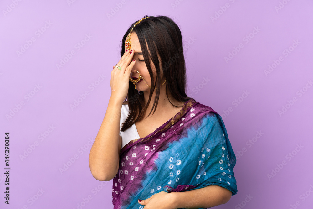 Young Indian woman isolated on purple background with headache Young Indian woman isolated on purple background with headache