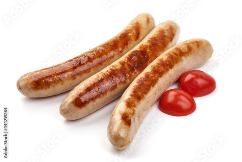 Grilled German pork sausages, Thuringer Rostbratwurst, close-up, isolated on white background. photo