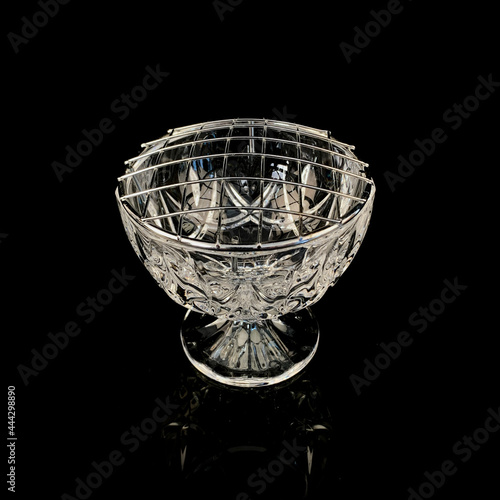 antique crystal rose bowl on black background