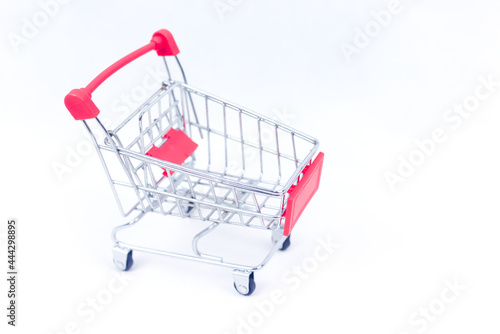 Red cart shoping concept isolated on white background