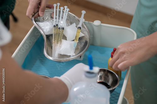 Close up of nurses or doctor hands preparing plasma syringes for PRP procedure - Platelet rich plasma rejuvenating treatment procedure