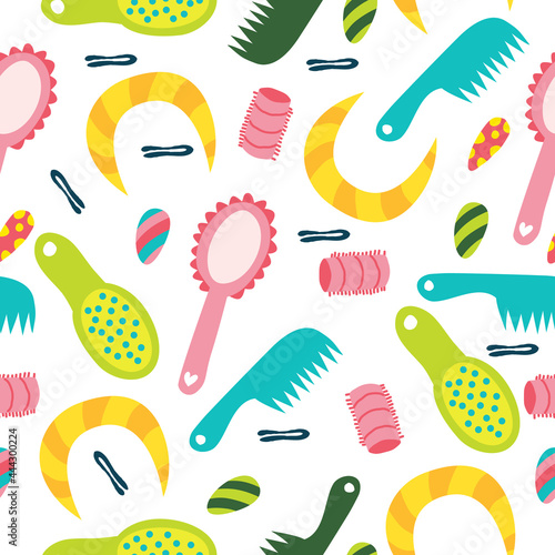 Seamless pattern with hairpins, combs, curlers. A pattern with elements for hairstyles. Vector illustration