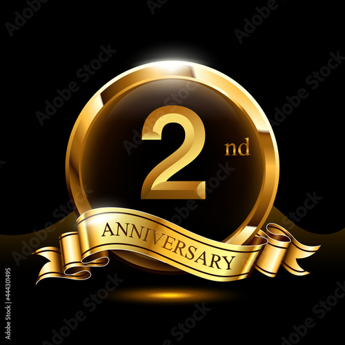 2 years golden anniversary logo celebration with ring and ribbon.