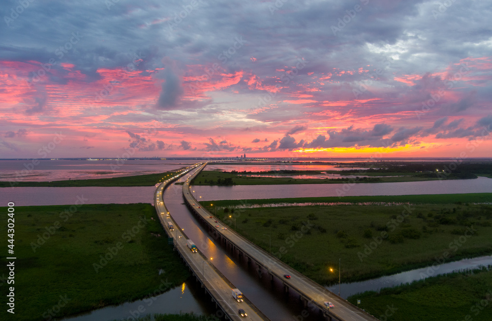 sunset over mobile bay bridge 