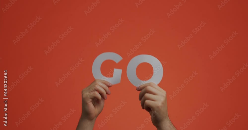 Hands showing word GO of english language. 4k video of arms gesturing with motivational phrase for sportive blog Hands showing word GO of english language. 4k video of arms gesturing with motivational phrase for sportive blog